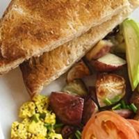 The Classic · 2 impossible sausages, tofu scramble, house potatoes, avocado, sliced roma tomatoes, and toa...