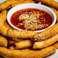 Pizza Fries · Pizza dough tossed with Italian seasoning and Parmesan with classic tomato sauce