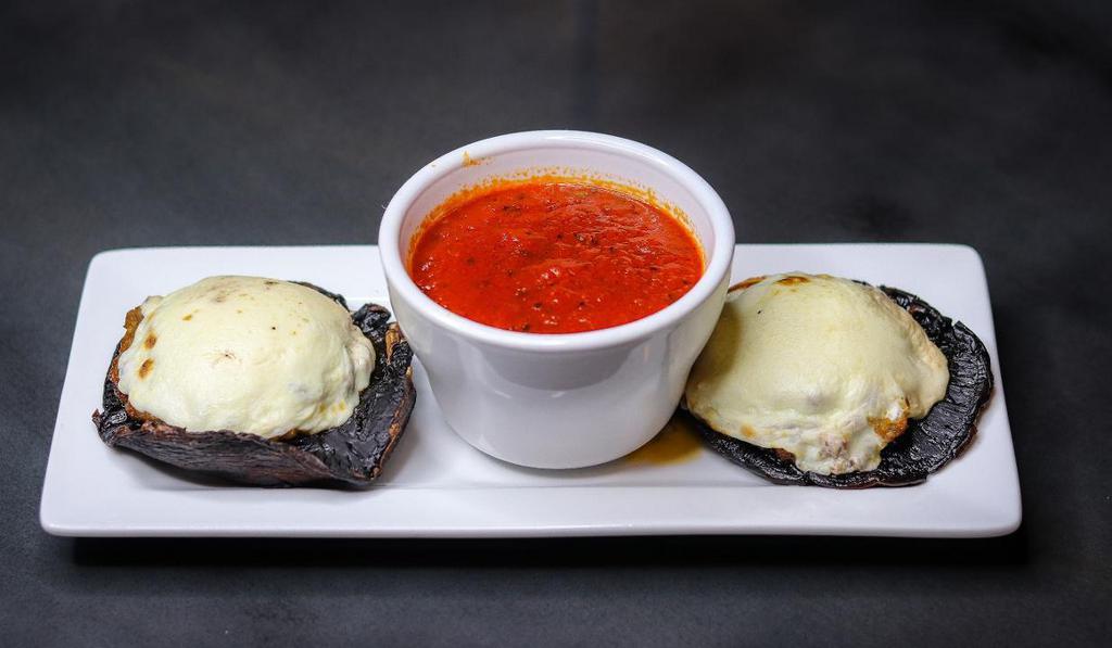 Stuffed Mushrooms · Portobello's filled with Italian sausage, Provolone, Parmesan and seasoned bread crumbs. Topped with fresh Mozzarella