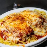 Chicken Parmesan · Parmesan crusted chicken breast served over spaghetti with classic tomato sauce and baked mo...