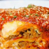 Lasagna · Layers of pasta with Italian sausage, ricotta, Italian cheeses and classic tomato sauce