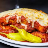 Sloppy Dago · Spicy Italian sausage patty sandwiched between sliced Vienna bread, smothered with classic t...
