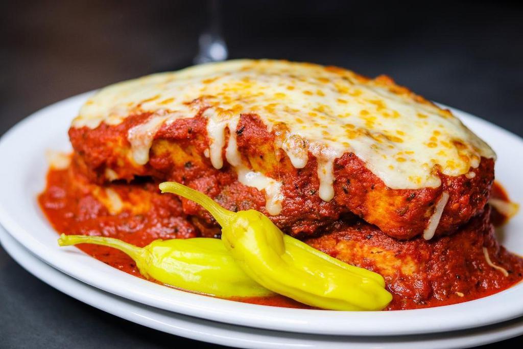 Sloppy Dago · Spicy Italian sausage patty sandwiched between sliced Vienna bread, smothered with classic tomato sauce and baked mozzarella