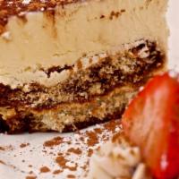 Tiramisu · Layers of espresso drenched sponge cake, mascarpone cream, dusted with cocoa powder