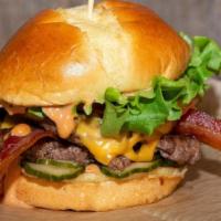 Bacon Cheese Burger · Two smash-cooked patties topped with American cheese, thick cut applewood smoked bacon, lett...