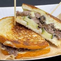 Patty Melt · 2 smash-cooked patties, toasted sourdough bread, Swiss cheese, forest mushroom ragout, house...