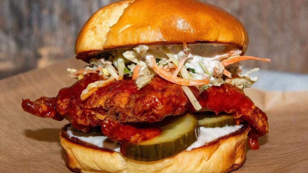 Buffalo Chicken Sandwich · Hand-breaded fried chicken tossed in our house-made buffalo sauce, topped with bleu cheese dressing, fresh sriracha kale slaw and dill pickles on a toasted bun.