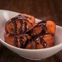 Warm Cinnamon Sugar Doughnuts · Served with chocolate ganache
