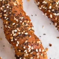 Everything Twist (Small) · The everything pretzel is topped with sesame seeds, poppy seeds, caraway seeds, garlic, onio...