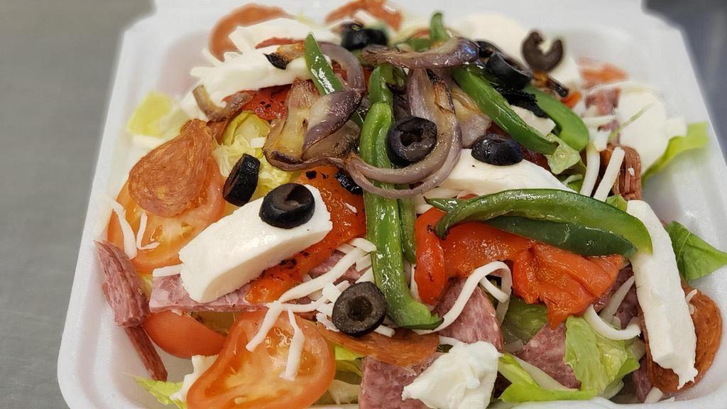 Classic Antipasto Salad · Roasted red peppers, green bell peppers and caramelized red onions, all roasted in our oven and placed over crisp romaine lettuce then topped with salami, pepperoni, black olives, cucumbers, Roma tomatoes, fresh mozzarella and provolone then drizzled with our house-made balsamic dressing. Served with a Parmesan baked bread stick.