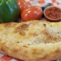 Calzone · Ya gonna score wit dis one! Like a football cut in half! A big, golden pizza dough turnover ...