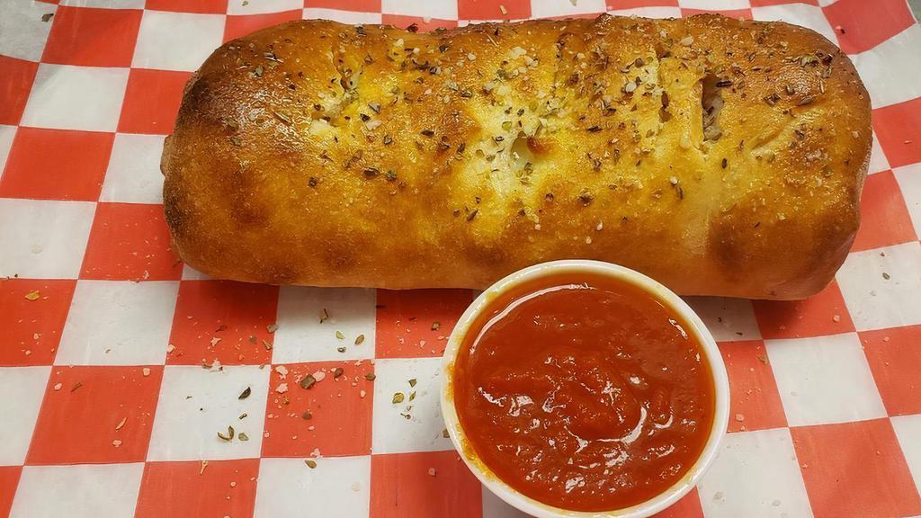 Stromboli · It’s not ‘zakly a sandwich, not ‘zakly a calzone. But a chunk of heaven, nonetheless! Full of pepperoni, sausage, gooey mozzarella and any other fillings you want!