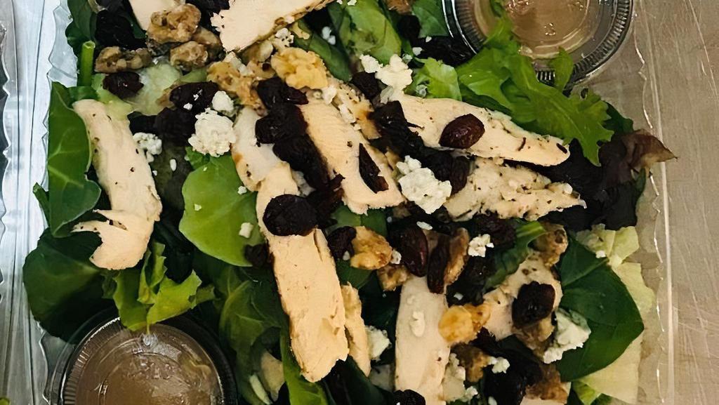 Cranberry Walnut Chicken Salad · Italian dressing, spinach, iceberg, romaine, grilled chicken, candied walnuts, cranberries, and blue cheese crumbles