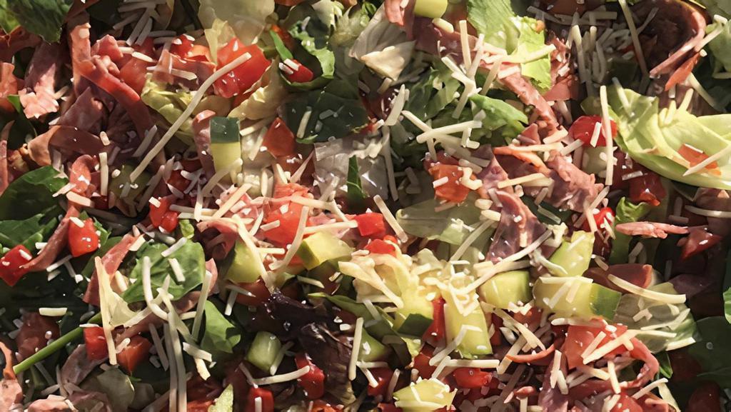 1/2 Chopped Salad · Balsamic dressing, iceberg, romaine, tomatoes, cucumbers, onions, red peppers, salami, capicola ham, and Parmesan cheese.