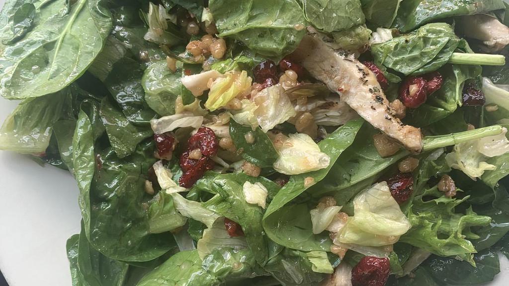 1/2 Cranberry Walnut Chicken Salad · Italian dressing, spinach, iceberg, romaine, grilled chicken, candied walnuts, cranberries, and blue cheese crumbles