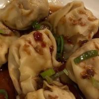 Chili Pepper Wontons · Our wontons are filled with a shrimp and pork. These flavorful bites are then topped with ci...