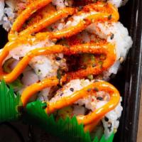 Spicy California · Crab stick, cucumber, avocado topped with spicy mayo & chili powder.