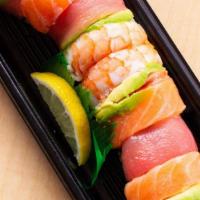 Rainbow · Crab stick, cucumber, avocado topped with combinations of salmon, Tuna , shrimp.