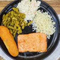 Wild Alaskan Salmon · Wild Alaskan Salmon seared to perfection and served on a bed of rice with your choice of two...
