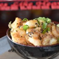 Bangin' Shrimp · Crispy fried shrimp tossed in our special spicy sauce, topped with sesame seeds and scallions.