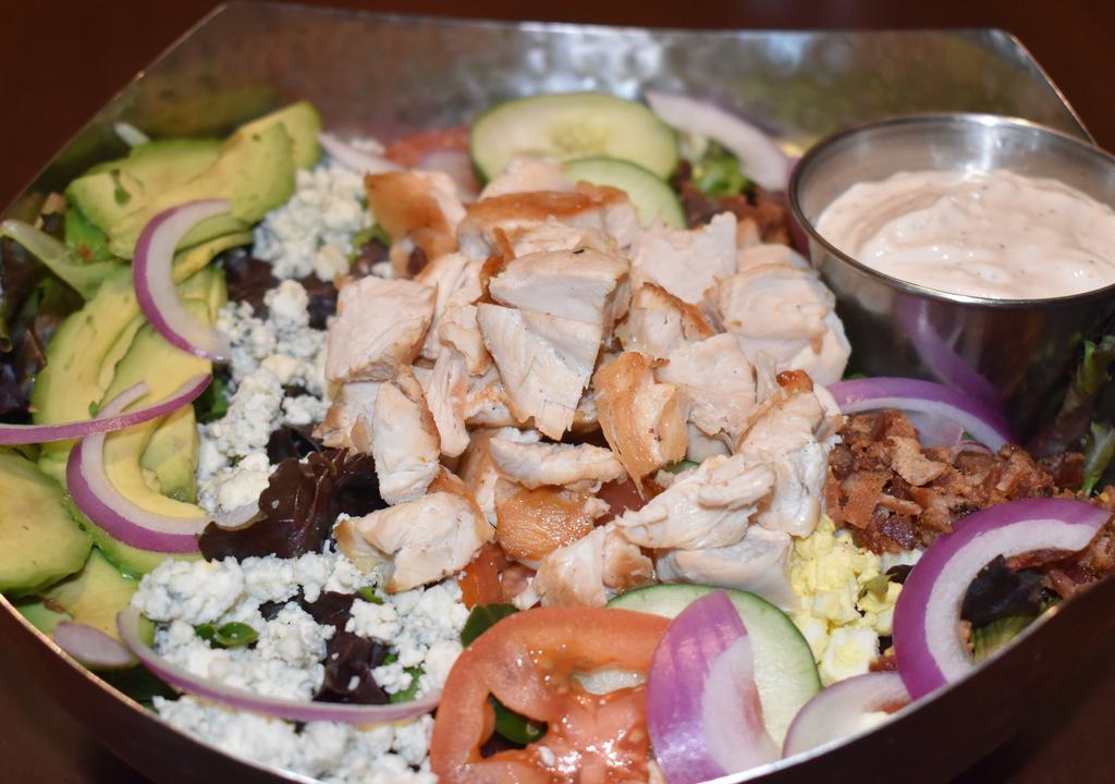 Chicken Cobb Salad · Grilled Chicken, house greens, bacon, tomatoes, hard boiled egg, avocado, cucumber, red onion, bleu cheese crumbles and choice of dressing.