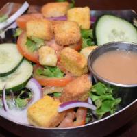House Side Salad · Spring mix with red onions, tomatoes, cucumbers and croutons. Served with your choice of dre...