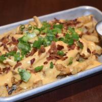 Loaded Fries · BurgerFin favorites. Seasoned fries topped with monterey jack, bacon & scallions.