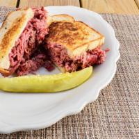 Corned Beef Sandwich · 1/3 lb. wiggley's thinly sliced corned beef with swiss cheese on grilled rye.