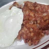 Corned Beef Hash · Served with two extra large eggs and toast with jelly.