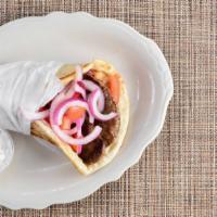 Gyro Pita · Tender lamb slices with tomatoes, onions and cucumber sauce.