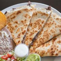 Quesadilla Special · A ﬂour tortilla grilled and stuffed with cheese, shredded chicken and mushrooms. Served with...