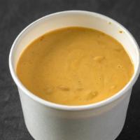 Nacho Cheese Sauce (12Oz) · A 12oz cup of our vegan cheese sauce.