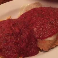 Veal Parmagiana Patty · Breaded veal patty topped with monte Carlo signature red Sauce and melted provolone cheese.