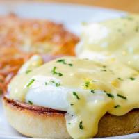 Eggs Benedict · poached eggs, roasted ham, english muffin, hollandaise, hashbrowns