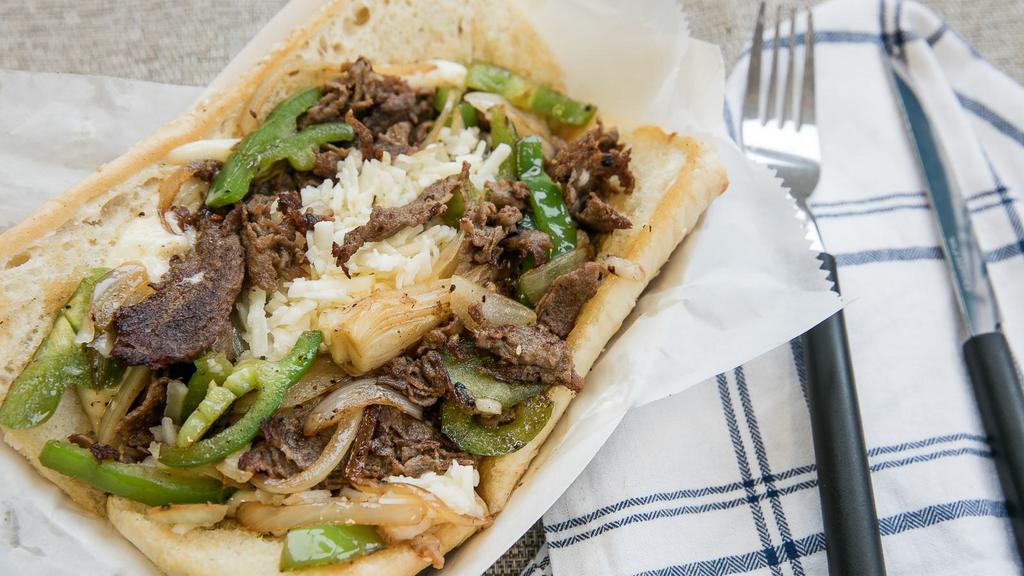 #7. Philly Cheese Steak · Served with fries and soda.