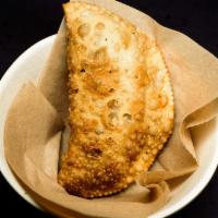 Pastel · A crispy empanada with your choice.