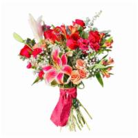 Crazy In Love  · Romantic and lush blooms including 12 long stemmed roses alongside premium filler in a vase.