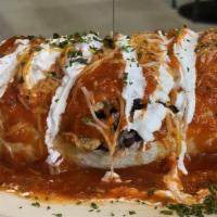 Smothered Burrito · A 12 inch flour tortilla stuffed with cheddar cheese, rice, beans, scrambled eggs and your c...