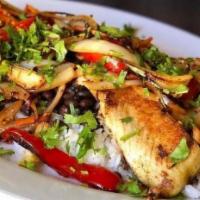 Tilapia · A bed of rice and whole black beans topped with grilled tilapia fillets and sauteed vegetabl...