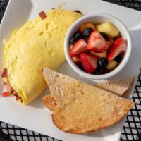 Omelet · Three large eggs with a choice of three: bacon, ham, smoked salmon, sausage, spinach, mushro...
