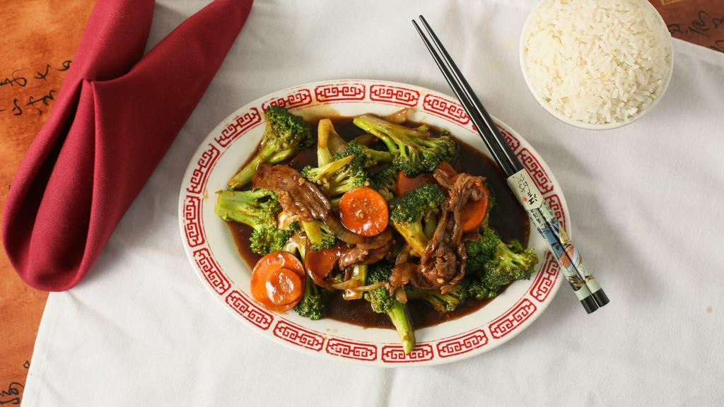 Beef & Broccoli · Tenderloin beef stir fried with fresh broccoli, carrot and onion in a dark sauce.
