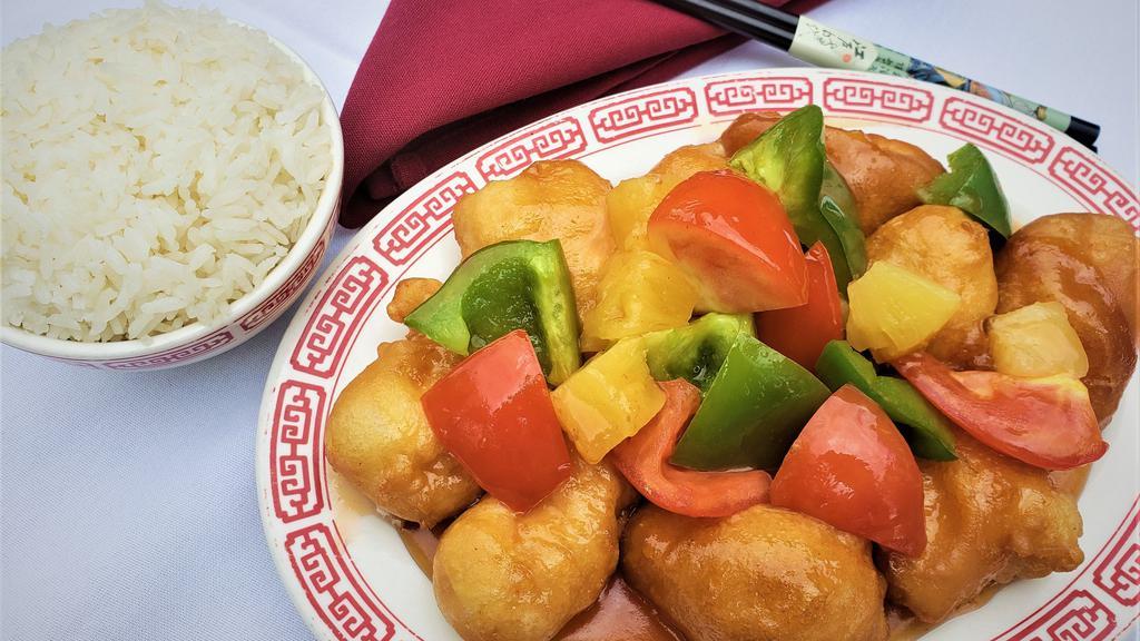 Sweet & Sour Pork · Fried pork loin with pineapple, green pepper and tomato mixed in our homemade sweet and sour sauce.