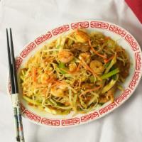 Singapore Noodles · Thin rice noodles mixed with shrimp, pork and vegetables seasoned with curry.