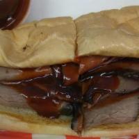 The Bbq · Slow roasted beef dipped in sweet and tangy Bbq sauce served with swiss on French roll.