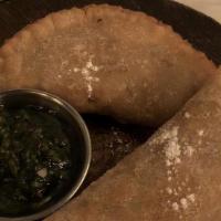Empanadas Criollas Con Chimichurri · Two homemade baked Argentinean mini pies. a fresh and light pastry filled with hand cut sirl...