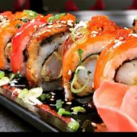 Rainbow Roll · (8 Pieces) Imitation crab, avocado, and cucumber topped with tuna, salmon, yellowtail, and r...