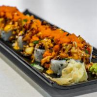 Dynamite Roll · (10 Pieces) California roll topped with baked spicy seafood mix, eel sauce, sesame seeds, an...