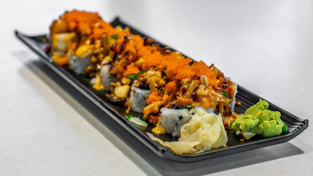 Dynamite Roll · (10 Pieces) California roll topped with baked spicy seafood mix, eel sauce, sesame seeds, and scallions.