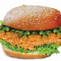 Crispy Chicken Burger · Crispy chicken, lettuce, tomatoes, pickles, mayo, and cheese on a brioche bun.