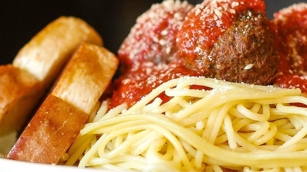 Spaghetti & Meatballs · A generous portion of spaghetti and four meatballs. Served with a side salad and garlic bread.
